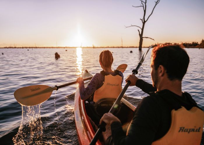 Couple enjoying an afternoon of kayaking along Lake Mulwala in Mulwala, The Murray